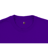 Close-up of purple crewneck t-shirt neckline with gold mask logo detail, Le Van Kamp Studio