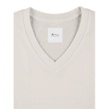 Close-up of V-neckline and M.V.K label on off white affirmation T-shirt, Le Van Kamp Studio
