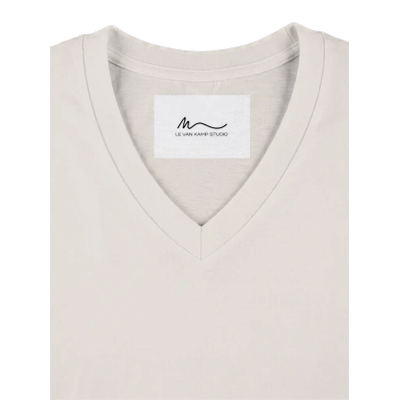 Details view of women's off white short sleeve V-neck affirmation T-shirt, Behave Beautifully series by Le Van Kamp Studio