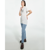 Angled model view: Woman modelling the white self-respect quote T-shirt with blue jeans and dark boots, one hand on her hip.